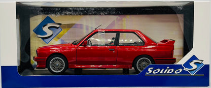 Red car model in a Solido box with branding