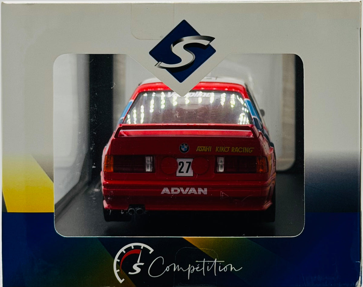 Red car model with 'BMW' and 'KBRP Racing' branding on a display box.