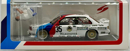 Model car in a display case with branding and details.