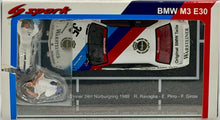 Load image into Gallery viewer, Model car packaging for a BMW M3 E30 with racing livery, featuring the Spark logo.